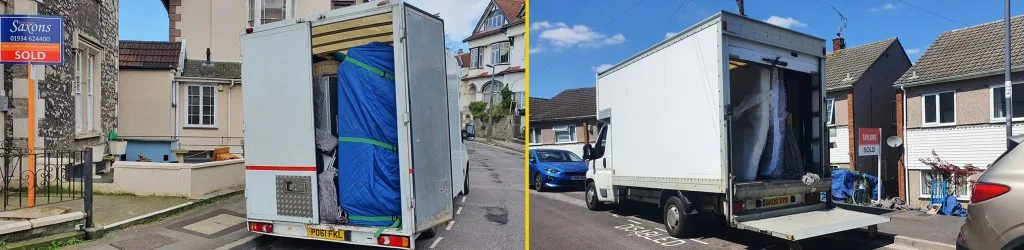 Two moving vans parked outside houses with sold signs, loaded with wrapped furniture.
